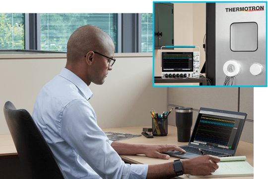 Engineer at his bench working space using remote software to control an oscilloscope and performaning measurements and analysis remotely